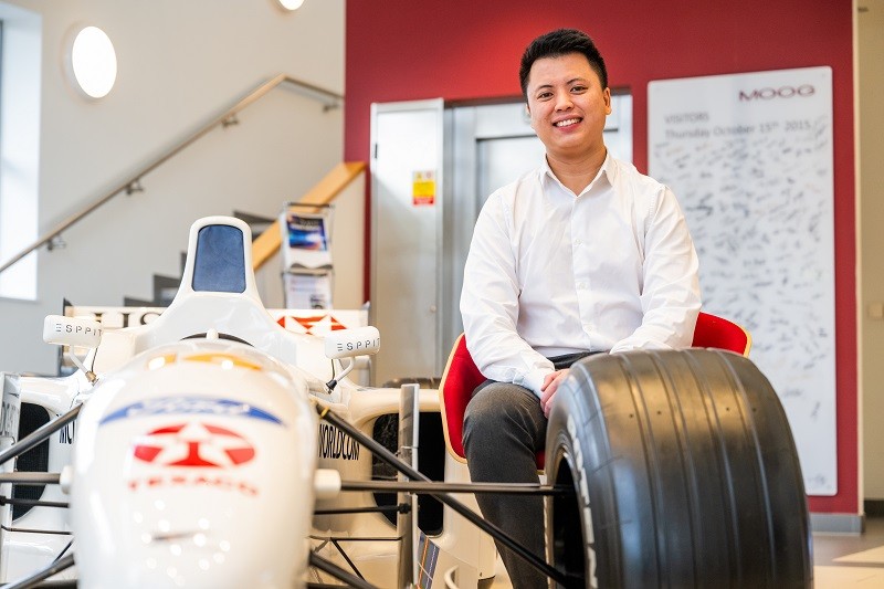 Chunfei pictured next to the Stewart F1 car owned by Moog
