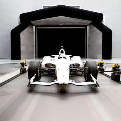 A racing car shown hooked up to Moog's active ride height test solution